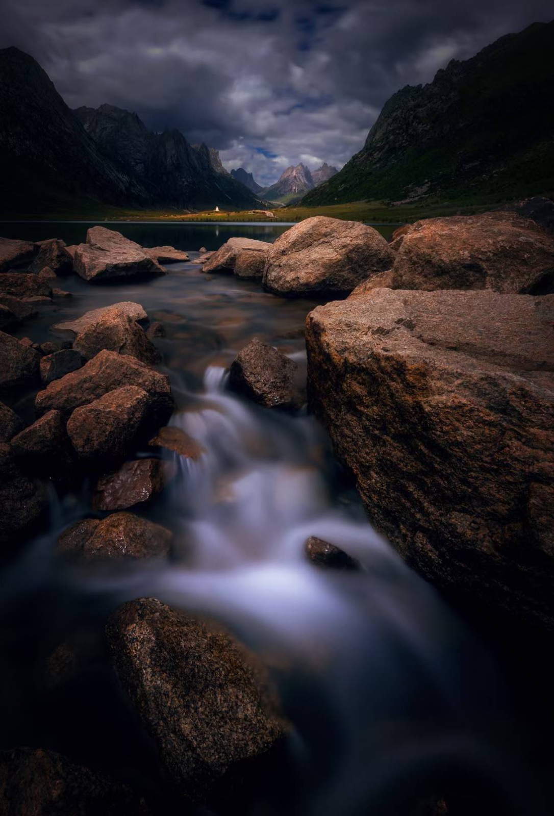 Cascade over red rock at dusk